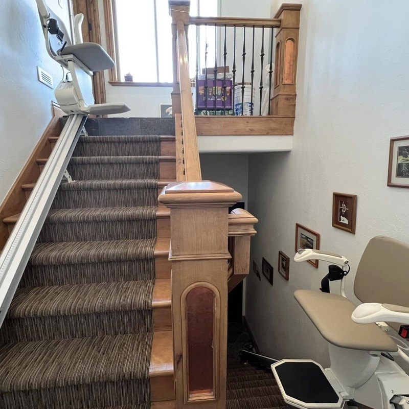 A stair lift on each flight of a split staircase